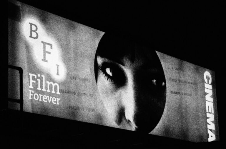 The BFI's lit-up "Film Forever" sign at night